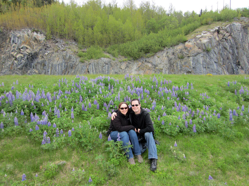 couple sitting in wildflowers