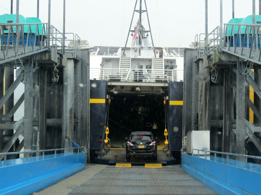 car driving onto a ferry