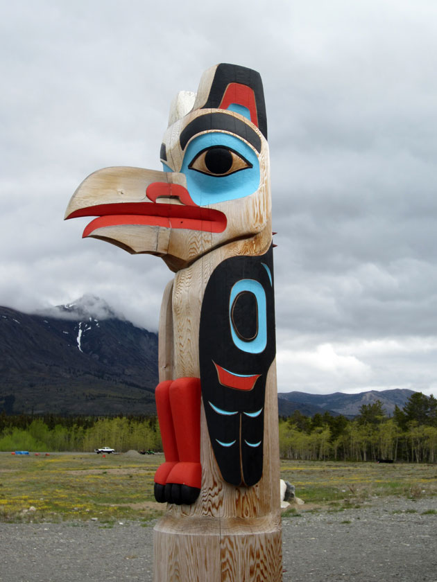 wooden totem of a raven