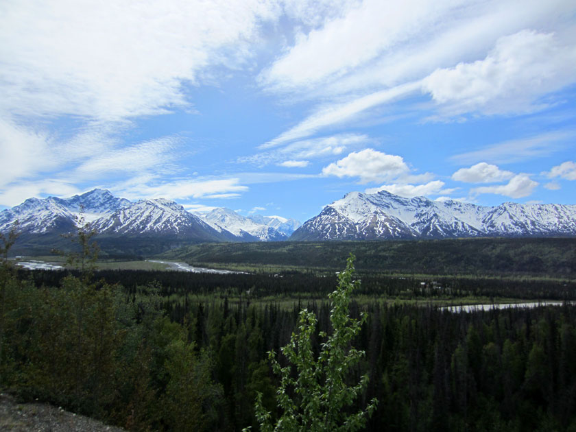 river valley with mountains and forest