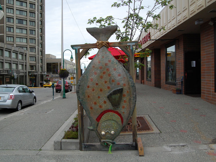 a large wooden and painted carving of a halibut