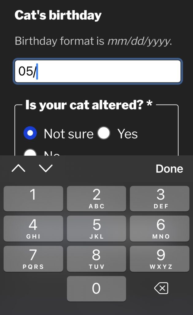 screen shot of a mobile website form with the cursor in a field called Cat's birthday while the numeric virtual keyboard displays below.