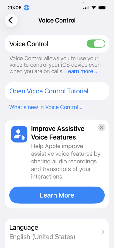 screenshot of the iOS Voice Control screen with Voice Control switched on. There is a blue icon next to the phone time indicating that Voice Control is listening.